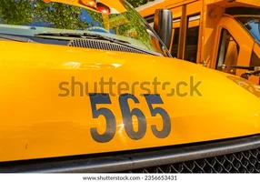 front-parked-yellow-school-bus-600w-2356653431.webp