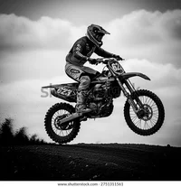 black-white-motocross-rider-jumping-600w-2751311561.webp